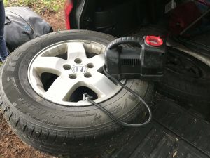 inflating a tire with a tire compressor