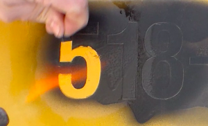 Using a blowtorch to remove skoolie decals