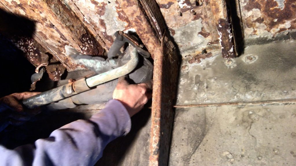 cutting hoses under the bus