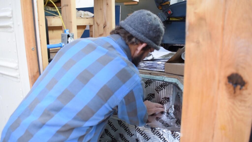 attaching kilmat to skoolie stairwell