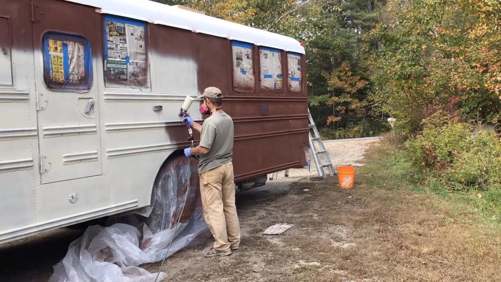 spraying skoolie paint