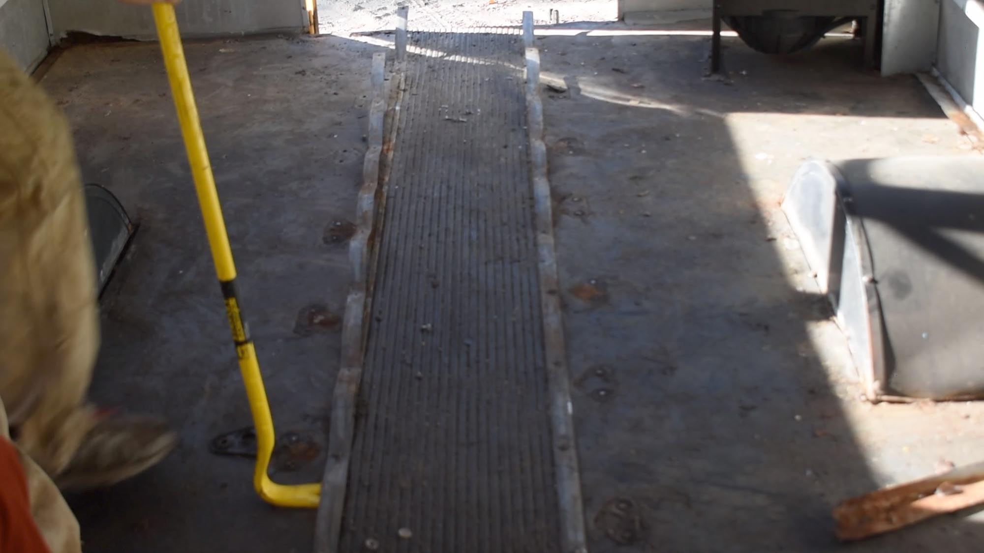 rip up metal strips from school bus floor